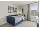 Cozy bedroom with a bed, skateboard art, and a gray curtained window at 886 Cypress Preserve Circle, Longs, SC 29568