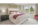 Elegant bedroom boasts a beautiful view, sophisticated furnishings, and a serene atmosphere at 886 Cypress Preserve Circle, Longs, SC 29568
