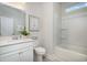 Clean bathroom featuring a tub, sink, modern toilet, and a bright window at 890 Ireland Dr., Longs, SC 29568