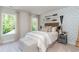 Beautiful bedroom featuring two windows, stylish wallpaper, and a cozy reading corner at 890 Ireland Dr., Longs, SC 29568