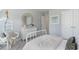 This bedroom features a hanging chair, white furniture, and plenty of natural light at 890 Ireland Dr., Longs, SC 29568