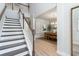 Bright entryway features hardwood floors and a staircase leading to the upper level at 890 Ireland Dr., Longs, SC 29568