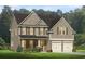 Charming two-story home features a two-car garage, brick accents, and a well-maintained lawn at 890 Ireland Dr., Longs, SC 29568