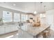 Bright kitchen features a large island with granite countertops and stainless steel appliances at 890 Ireland Dr., Longs, SC 29568