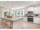 Well-lit kitchen boasts stainless steel appliances, granite counters and large island seating at 890 Ireland Dr., Longs, SC 29568