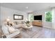Bright and cozy living room with large windows and stylish decor at 890 Ireland Dr., Longs, SC 29568
