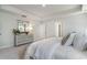 Bright and airy main bedroom with tray ceiling, a dresser with mirror, and white bedding at 890 Ireland Dr., Longs, SC 29568