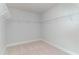 A simple but large walk-in closet featuring wire shelving and carpeted floor at 890 Ireland Dr., Longs, SC 29568