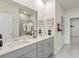 Elegant bathroom with double vanity, modern fixtures, and a glass-enclosed shower at 899 Cypress Preserve Circle, Longs, SC 29568