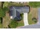 An aerial view showcases the home's layout, driveway, landscaping, and roof at 912 Berwick Ln., Myrtle Beach, SC 29579