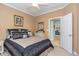 Comfortable bedroom with stylish comforter and open doorway to the dining room at 912 Berwick Ln., Myrtle Beach, SC 29579