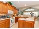 Bright kitchen with stylish wooden cabinets, counter lighting, and modern white appliances at 912 Berwick Ln., Myrtle Beach, SC 29579