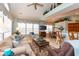Inviting living room with bright windows, comfortable seating, and a view of the dining area at 912 Berwick Ln., Myrtle Beach, SC 29579
