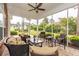 Screened porch with comfortable wicker furniture, perfect for outdoor relaxation and entertaining at 912 Berwick Ln., Myrtle Beach, SC 29579
