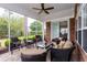 Inviting screened patio with comfortable seating, a ceiling fan, and a view of the outdoor landscape at 912 Berwick Ln., Myrtle Beach, SC 29579