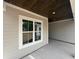 Covered back porch with an outdoor window at 924 Morrall Dr., North Myrtle Beach, SC 29582