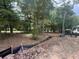 View of the wooded backyard showing the landscape undergoing some light construction at 924 Morrall Dr., North Myrtle Beach, SC 29582