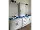 Bathroom with double vanities, white cabinets, black fixtures and modern lighting at 924 Morrall Dr., North Myrtle Beach, SC 29582