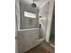 Modern bathroom featuring marble tile shower with rain shower head and a built-in niche at 924 Morrall Dr., North Myrtle Beach, SC 29582