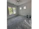Spacious bedroom featuring two large windows, a ceiling fan, and neutral walls at 924 Morrall Dr., North Myrtle Beach, SC 29582