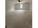 Large unfinished bonus room featuring a neutral color palette and a ceiling fan at 924 Morrall Dr., North Myrtle Beach, SC 29582
