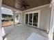 Covered patio with outdoor ceiling fan leads to the landscaped backyard at 924 Morrall Dr., North Myrtle Beach, SC 29582