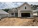 Charming home featuring a welcoming front porch and two-car garage, showcasing its appealing curb appeal at 924 Morrall Dr., North Myrtle Beach, SC 29582