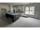 Open kitchen with black island, white cabinets and stainless steel appliances at 924 Morrall Dr., North Myrtle Beach, SC 29582