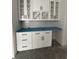 White kitchen cabinetry with black hardware and light countertops at 924 Morrall Dr., North Myrtle Beach, SC 29582