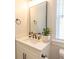 Bathroom featuring a quartz countertop, framed mirror, and sleek finishes at Simpson Creek Dr., Loris, SC 29569
