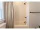 Clean bathroom featuring a shower and a tub combo, tile backsplash, and a shower curtain at Simpson Creek Dr., Loris, SC 29569