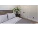 Serene bedroom featuring natural accents, and a decorative plant on the nightstand at Simpson Creek Dr., Loris, SC 29569