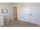 Neutral bedroom with carpet, closet and white trim, offering a serene retreat at Simpson Creek Dr., Loris, SC 29569
