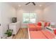 Bright bedroom with two twin beds, ceiling fan, and large window at Simpson Creek Dr., Loris, SC 29569
