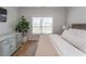 Sunlit bedroom with wooden floors and ceiling fan at Simpson Creek Dr., Loris, SC 29569
