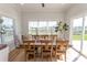 Sun-filled dining room featuring a large wooden table and access to the backyard at Simpson Creek Dr., Loris, SC 29569