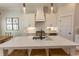 Contemporary kitchen with stainless appliances, quartz counters, and ample cabinet space at Simpson Creek Dr., Loris, SC 29569