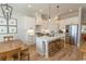 Modern kitchen with stainless steel appliances, a large island, and stylish pendant lighting at Simpson Creek Dr., Loris, SC 29569