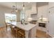 Well-equipped kitchen featuring a spacious island, modern appliances, and a bright dining area at Simpson Creek Dr., Loris, SC 29569