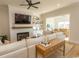 Bright living room with a fireplace, built-in shelves, and seamlessly connected to the dining area at Simpson Creek Dr., Loris, SC 29569