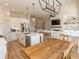 Open-concept kitchen flows into a spacious living room with custom shelving and a fireplace at Simpson Creek Dr., Loris, SC 29569