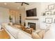 Comfortable living room featuring a fireplace with TV, perfect for relaxing and entertaining guests at Simpson Creek Dr., Loris, SC 29569