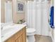 Well-maintained bathroom featuring a shower with a white curtain and modern fixtures at 1005 Kelly Ct., Garden City Beach, SC 29576