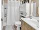 Clean bathroom featuring a shower with white curtain and white vanity at 1005 Kelly Ct., Garden City Beach, SC 29576