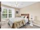 Bedroom featuring ceiling fan, natural light, neutral color scheme, and carpeted floors at 1005 Kelly Ct., Garden City Beach, SC 29576