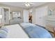 Spacious bedroom with dresser, large windows, and natural light at 1005 Kelly Ct., Garden City Beach, SC 29576