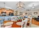An open-concept dining room with a view of the kitchen and living space at 1005 Kelly Ct., Garden City Beach, SC 29576