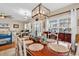 Well-lit dining room features a decorative chandelier and elegant furnishings at 1005 Kelly Ct., Garden City Beach, SC 29576