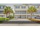Spacious townhome with ample parking, including a garage that fits up to three vehicles and charming landscaping at 1005 Kelly Ct., Garden City Beach, SC 29576