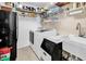 Well-equipped laundry area with modern washer, dryer, and sink at 1005 Kelly Ct., Garden City Beach, SC 29576